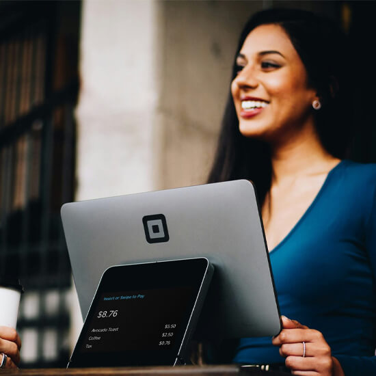 Dev Tech Solutions | One of our Insight Article images showing a women working on a grey computer