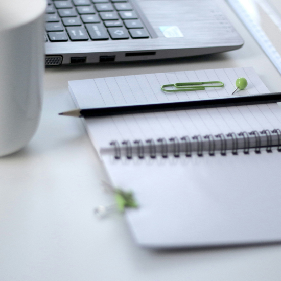 Dev Tech Solutions | Displaying a notebook and a pencil