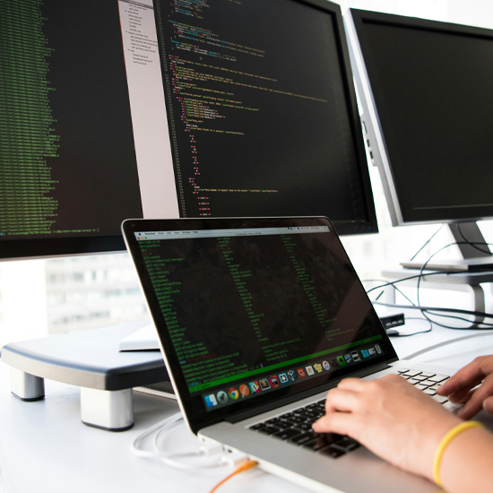 Dev Tech Solutions | showing various screens in a desk setup